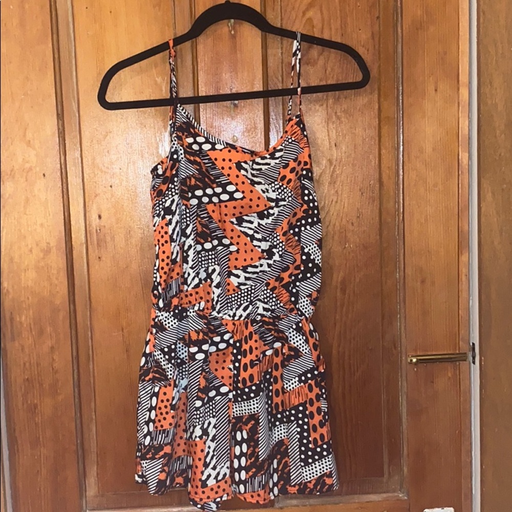 Orange white and black patterned romper